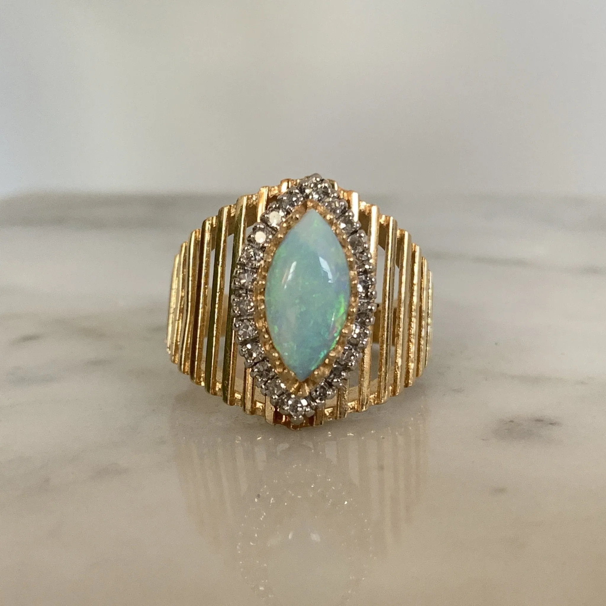 1970s Opal and Diamond Halo Statement Ring in a Large 14K Yellow Gold Setting.