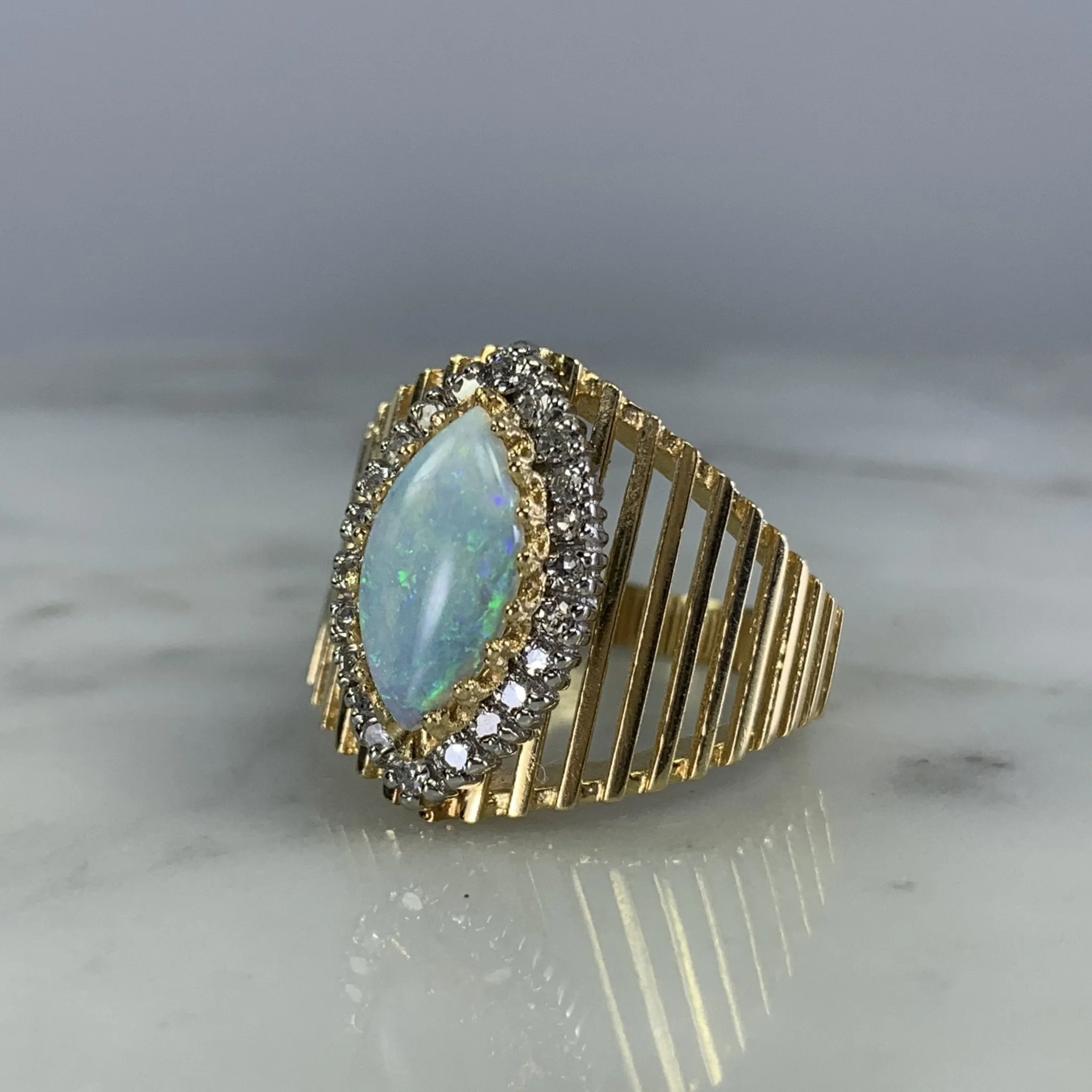 1970s Opal and Diamond Halo Statement Ring in a Large 14K Yellow Gold Setting.